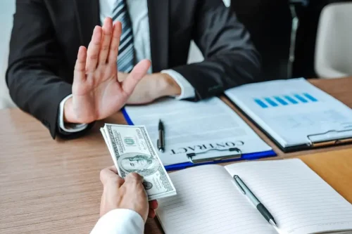 midsection-man-holding-hands-table_1048944-7333393